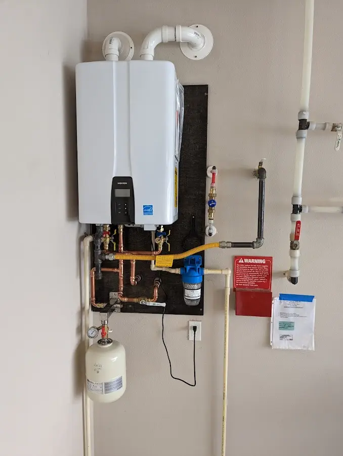 Professional plumber installing copper piping in a Gulf Shores home